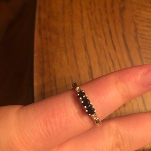 Dainty white gold band with black sapphire stones